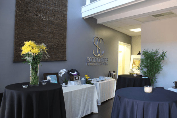 Wideshot of Sign In Sheet and Pastry Set Up for Opening Event