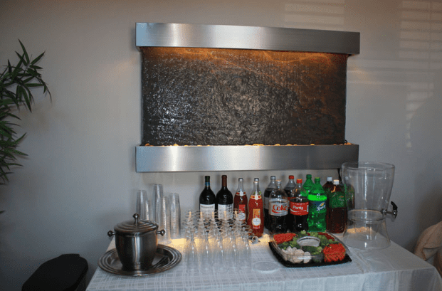 Drink Table Set Up Below Waterfall Installation for Opening Event