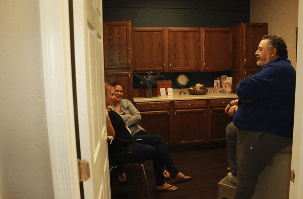 Open Event Guests Conversing in Examination Room