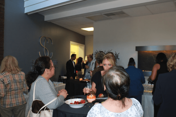 Opening Event Guests Conversing with Drinks - D