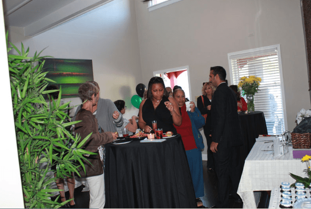 Wide Shot of Opening Event Guests Eating at Table