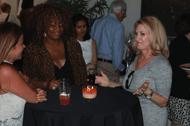 Opening Event Guests Conversing with Drinks - B