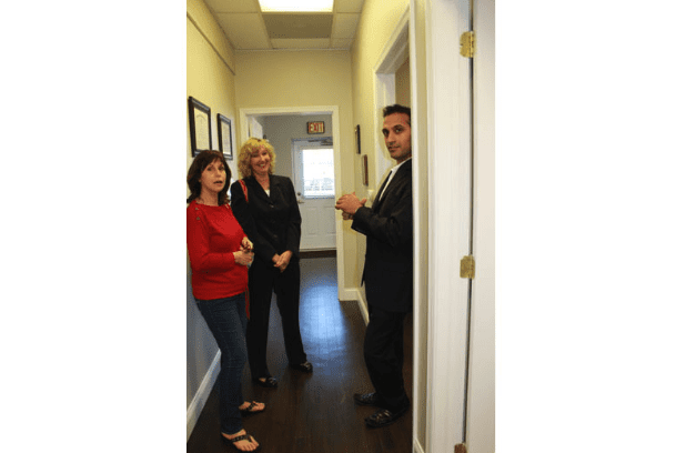 Dr. Sood and Event Guests Talking in the Office Hallway
