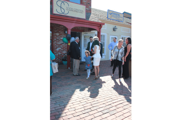 Front Entrance of the Office with Event Guests - Far Shot B