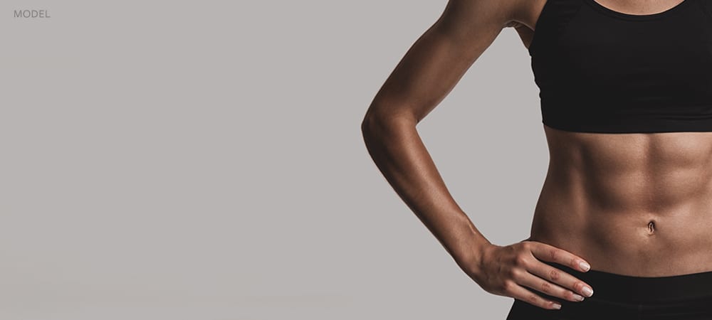 SoodCenter_Cooltone_Header_Female-with-tones-abs-hands-on-hips